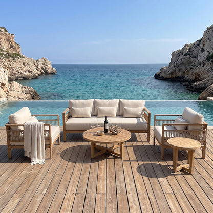 Outdoor lounge furniture set arranged on a wooden deck overlooking the ocean