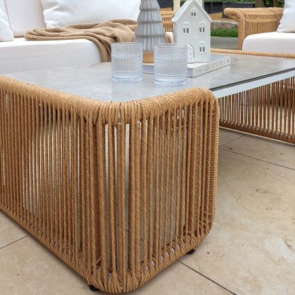 Close-up of the Avon 5-Seater Premium Aluminium Rattan Outdoor Lounge Set showcasing its wicker texture and elegant design, featuring a stylish coffee table and comfortable seating arrangement.