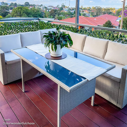 Ballena 6 Seater Wicker Outdoor Dining Sofa Set – Warm Grey/Light Beige, showcased with its sleek wicker design, padded cushions, and accompanying glass-top table, perfect for stylish patio dining.