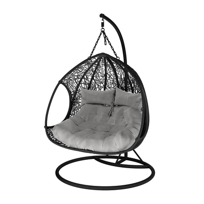 Basin 2-Seater Hanging Egg Chair with Cushion in Black, featuring a woven rattan-style frame on a metal stand, showcasing a plush tufted cushion for comfortable seating.