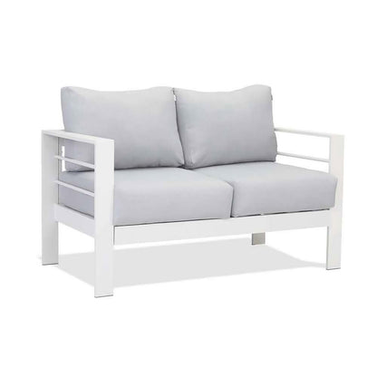 Luxo Bayo 6 Seater Aluminium Outdoor Furniture Set features a plush white cushion, enhancing comfort. Designed for outdoor lounging, it offers thick 15cm cushions, perfect for garden parties.
