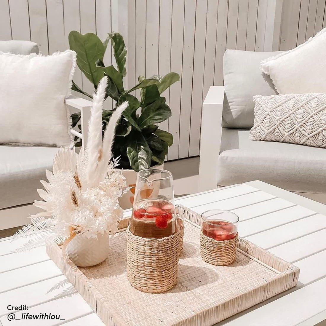 Luxo Bayo 6 Seater Aluminium Outdoor Furniture Set featuring a white pillow on a shelf, emphasizing the comfort and style with 15cm thick cushions, ideal for garden gatherings.