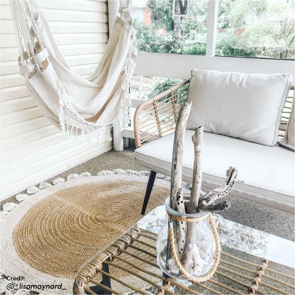 Bequia 4 Seater Rope Wicker Outdoor Sofa Light Beige features a sleek rope-wicker design with cushioned seating, ideal for outdoor lounging. Visually, the sofa incorporates Scandinavian-inspired legs and a clear glass table surface.