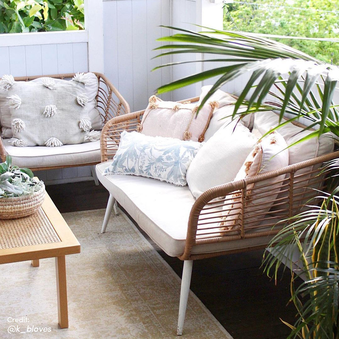 Bequia 4 Seater Rope Wicker Outdoor Sofa Light Beige showcasing a close-up view of its plush cushions, set against a backdrop of elegant wicker detailing, embodying contemporary outdoor luxury.
