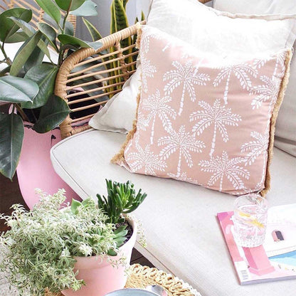 Bequia 4 Seater Rope Wicker Outdoor Sofa, featuring high-density foam cushions on a wicker frame. The sofa's coffee table is topped with clear tempered glass.