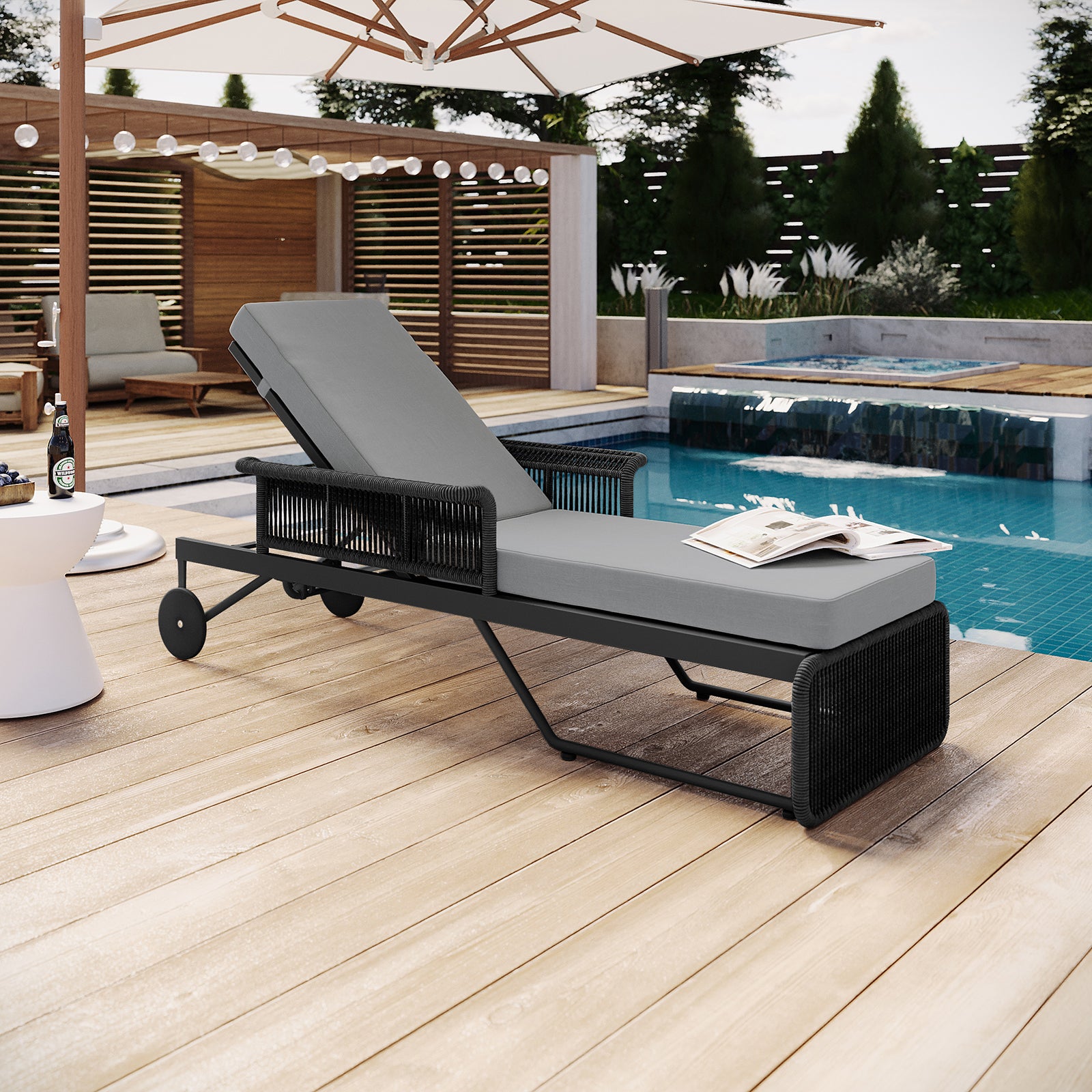 Boonoo Premium Aluminium Outdoor Rattan Sun Lounger Grey with adjustable recline, handwoven rattan detailing, and plush cushions, set elegantly near a swimming pool and outdoor coffee table.