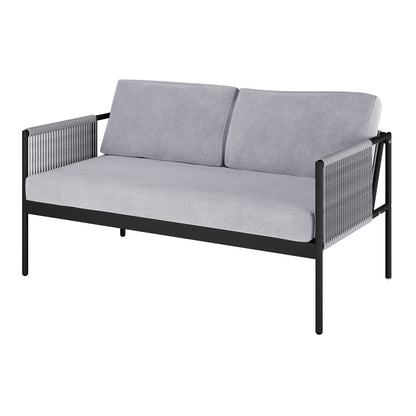 Brujas 4 Seater Wicker Outdoor Lounge Set in Grey features a two-seat sofa with a slim black metal frame, light-gray cushions, and rope-wrapped arm panels, embodying a modern, minimalist aesthetic.