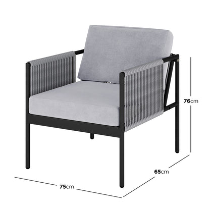 Modern outdoor armchair from the Brujas 4 Seater Wicker Outdoor Lounge Set in Grey, featuring a powder-coated black metal frame, light-grey cushions, and rope-wrapped arm panels with minimalist design.