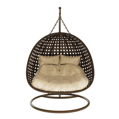Buena 2 Person Wicker Outdoor Hanging Egg Chair in Brown features a freestanding, egg-shaped design with dark brown woven rattan, plush beige cushions, and a sturdy metal frame, ideal for relaxing.