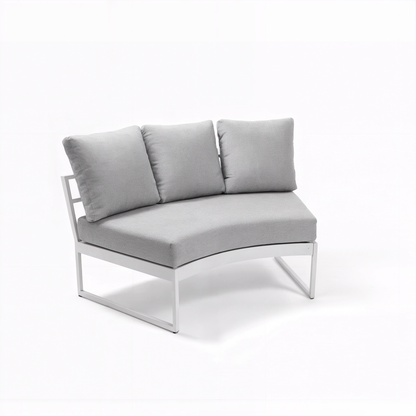 Callanna 5-Seater Round Outdoor Lounge Set in White features a curved-corner module with a white metal frame, contoured light gray seat cushion, and three matching loose back cushions, showcasing modern design and comfort.