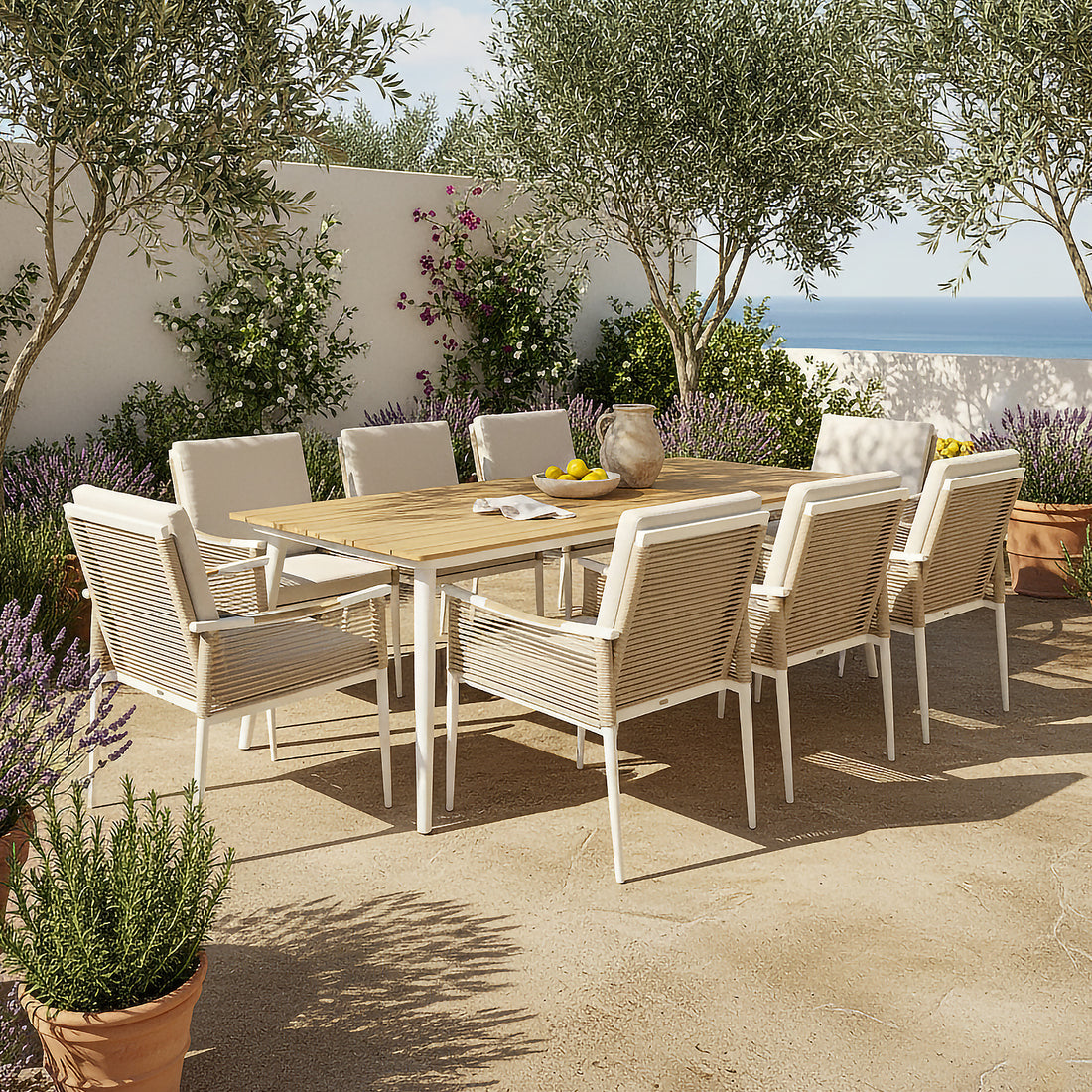 Casara 9 Piece Outdoor Dining Set in White and Beige features a wooden-topped table with slender metal legs, surrounded by eight white-washed wooden chairs with woven backs and cushioned seats, set on a sunlit terrace.