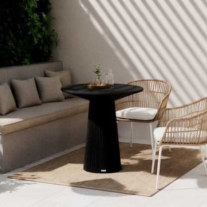 Darien 80cm Round Concrete Bistro Table in Grey Marble features a sleek, marble-look top and fluted base, set in a sunny patio nook with wicker chairs and decorative tray.