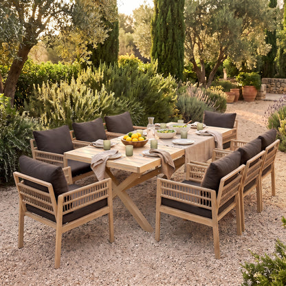 Outdoor wooden dining set with eight chairs arranged in a garden setting