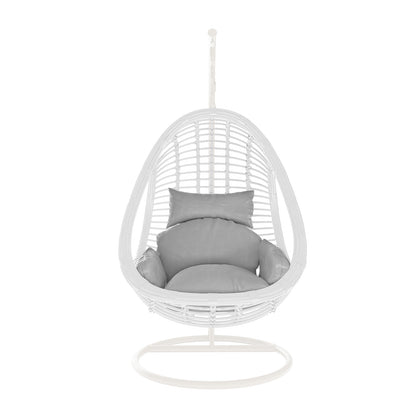 Deanna Curved Rattan Hanging Outdoor Egg Chair in White: A woven shell on an arched metal frame with plush gray cushions, ideal for stylish, comfortable indoor or outdoor seating.