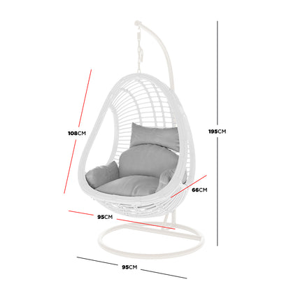 Deanna Curved Rattan Hanging Outdoor Egg Chair in White, featuring a suspended open-weave rattan shell with plush cushions, supported by a curved metal frame, showcasing essential measurements for versatile indoor or outdoor placement.