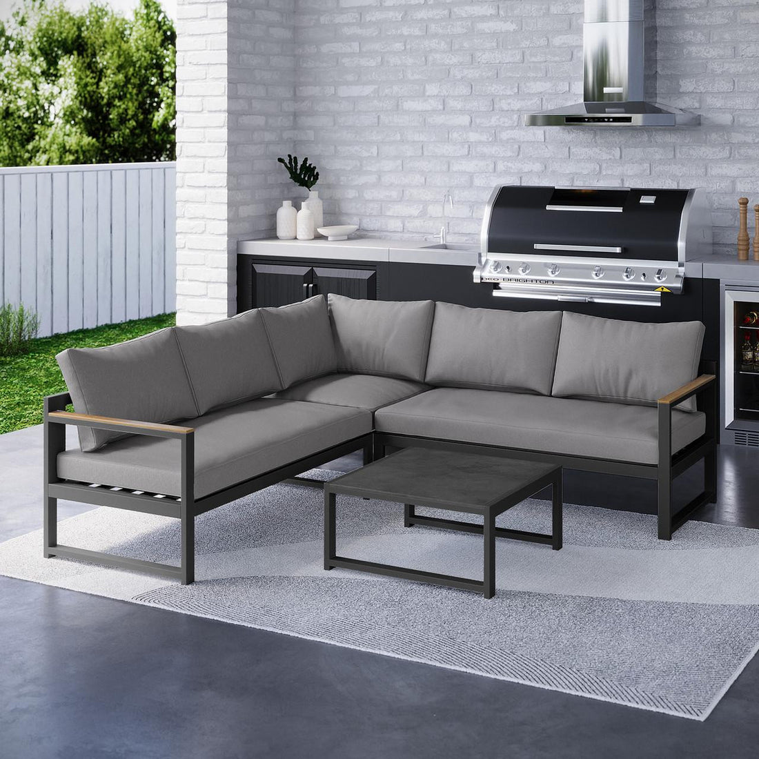 Deloran 5-Seater Modular Corner Aluminium Outdoor Lounge Set Grey featuring an L-shaped sofa with metal frame, wood accents, soft cushions, and a matching low coffee table, set in a stylish outdoor environment.