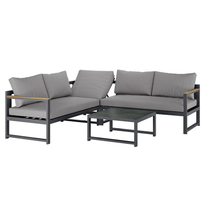 Deloran 5-Seater Modular Corner Aluminium Outdoor Lounge Set Grey featuring a two-piece L-shaped sectional sofa with gray cushions on a dark metal frame, accompanied by a matching low coffee table.