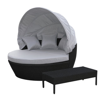 Close-up of the Erith Wicker Outdoor Furniture Day Bed w/ Canopy, showcasing its luxurious design and plush cushions, perfect for relaxing outdoors.