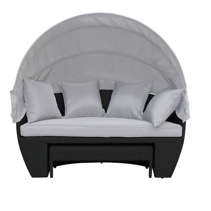 Erith Wicker Outdoor Furniture Day Bed w/ Canopy showcases a plush white pillow on its surface, highlighting comfort and luxury. The day bed is designed for outdoor relaxation and entertaining.