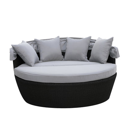 Close-up of Erith Wicker Outdoor Furniture Day Bed w/ Canopy, showcasing its plush cushions and sturdy wicker construction, ideal for outdoor relaxation and comfort.