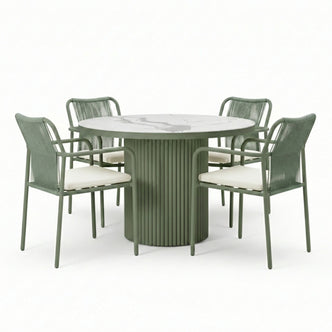 Evone 4 Seater Stone Outdoor Dining Table Set in Green, featuring a round marble-look tabletop and fluted base, with four metal-framed chairs with woven backs and white cushions.