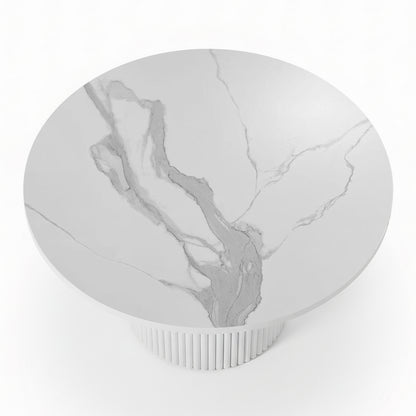 Evone 4 Seater Stone Outdoor Dining Table Set features a round, white marble-patterned tabletop with light gray veining on a fluted pedestal base, perfect for stylish outdoor dining.