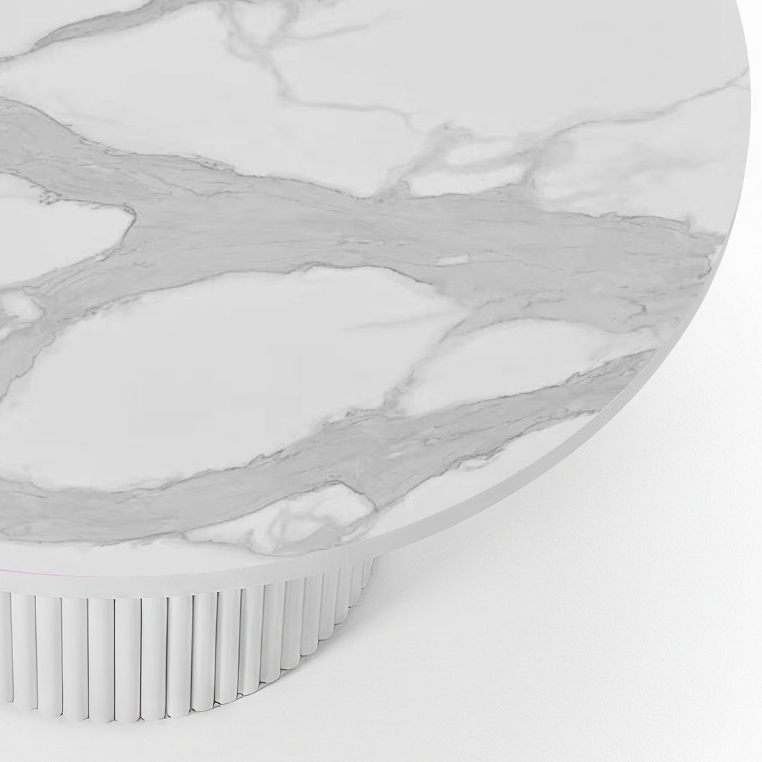 Close-up of the Evone 4 Seater Stone Outdoor Dining Table Set in Natural, featuring a round white marble-effect tabletop with gray veining, atop a cylindrical, fluted white pedestal base.