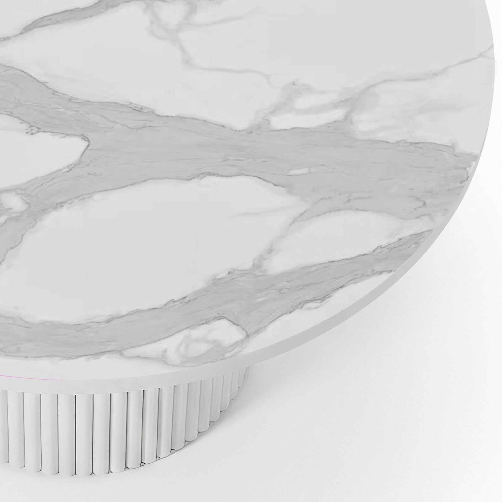 Close-up of the Evone 4 Seater Stone Outdoor Dining Table Set in Natural, featuring a round white marble-effect tabletop with gray veining, atop a cylindrical, fluted white pedestal base.