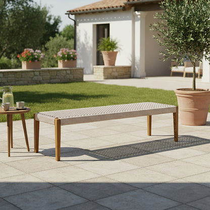 Fentan 4 Seater Acacia Hardwood Outdoor Bench in Beige, featuring a woven-strap seat and wooden legs, set in a sunlit patio with a side table and potted olive tree.