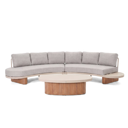 Curved sectional sofa with matching round coffee table on a white background.