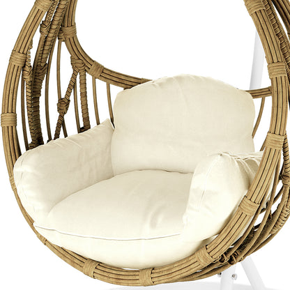 Hookipa Outdoor Rattan Egg Chair with Cushion in Cream White, showcasing a woven rattan shell with a thick cushion and padded armrests, suspended for a stylish indoor or outdoor seating option.