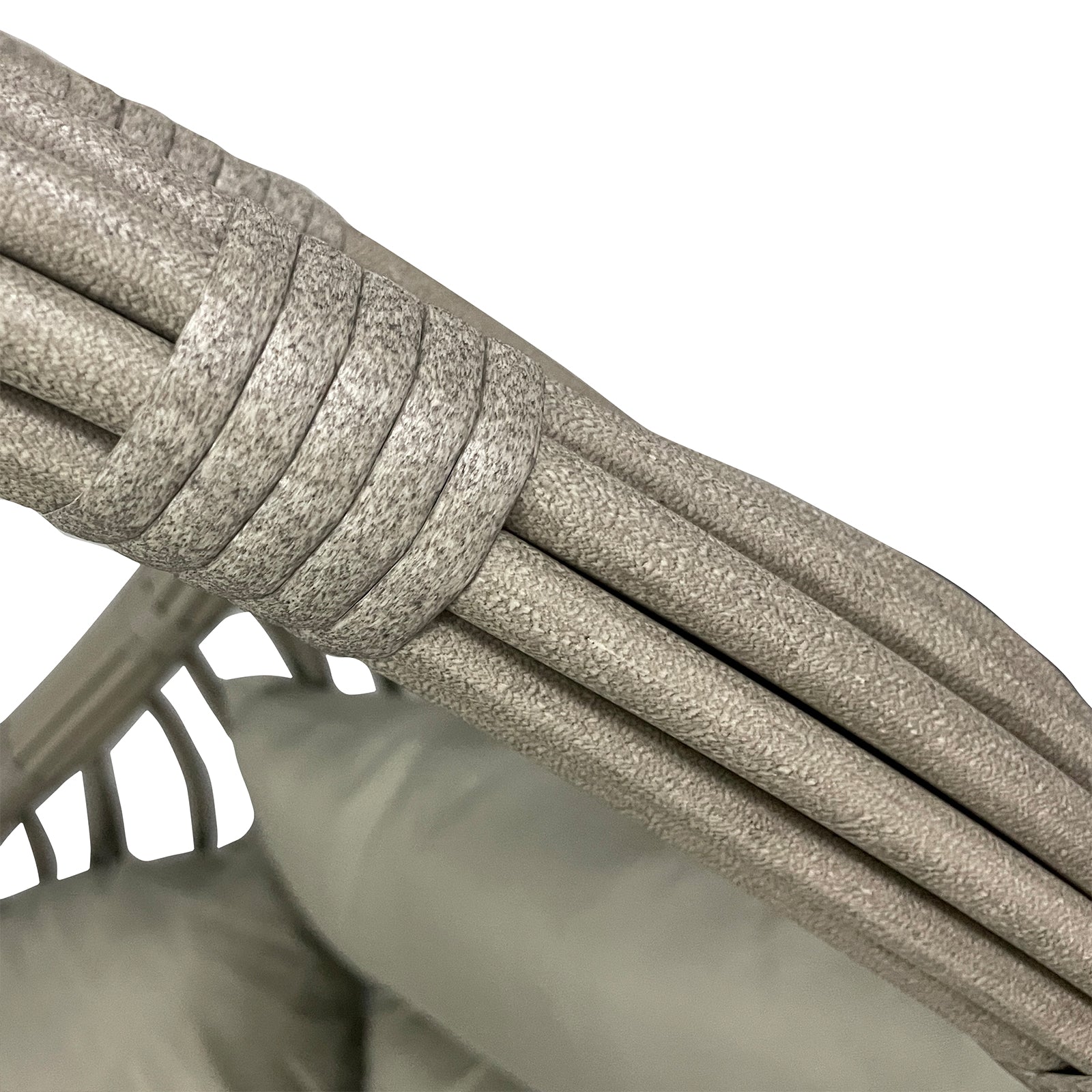 Close-up of Hookipa Outdoor Rattan Egg Chair with Cushion in Sage, showcasing woven synthetic ropes around curved metal tubing, with part of the seat cushion visible at the bottom.