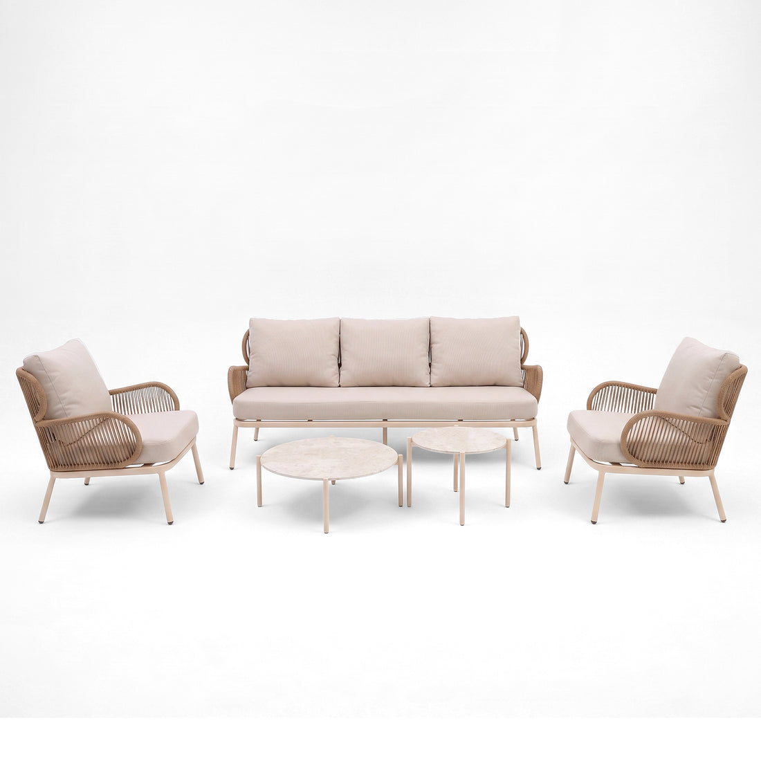 Modern seating set with sofa, two armchairs, and two round coffee tables on a white background