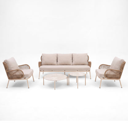Modern seating set with sofa, two armchairs, and two round coffee tables on a white background