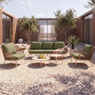 Modern outdoor furniture set arranged in a stylish patio courtyard with decorative accessories