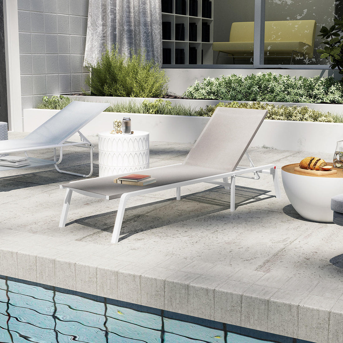 Jabari Textilene Aluminium Outdoor Sunbed in Light Grey, featuring a minimalist design with a durable metal frame and adjustable reclining positions, set beside a pool on light-colored tiles.