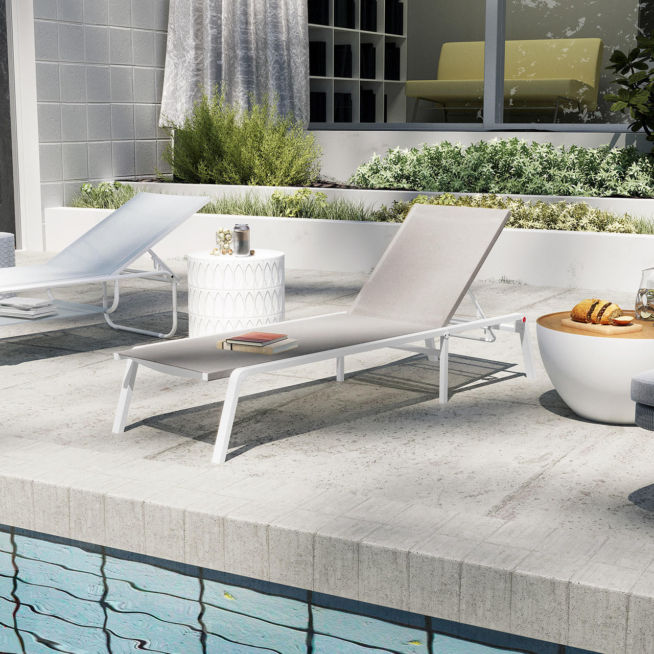 Jabari Textilene Aluminium Outdoor Sunbed in Light Grey, featuring a minimalist design with a durable metal frame and adjustable reclining positions, set beside a pool on light-colored tiles.