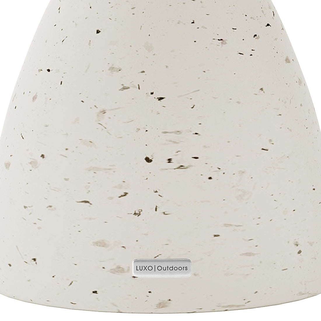 Detail shot of the Junia Terrazzo concrete side table's speckled surface and base, featuring the Luxo Outdoors tag