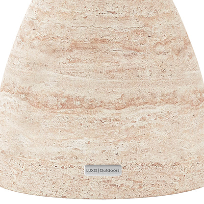 Detail shot of the Junia Travertine concrete side table's speckled surface and base, featuring the Luxo Outdoors tag