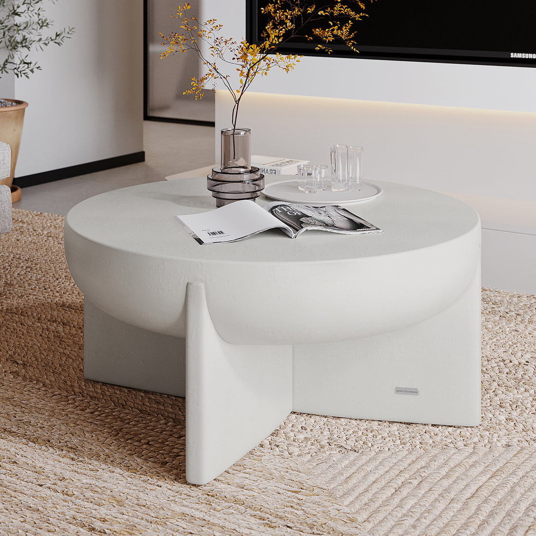 Kora White Concrete Pedestal Coffee Table styled in a modern living room with decor, perfect for indoor outdoor use - Lifestyle