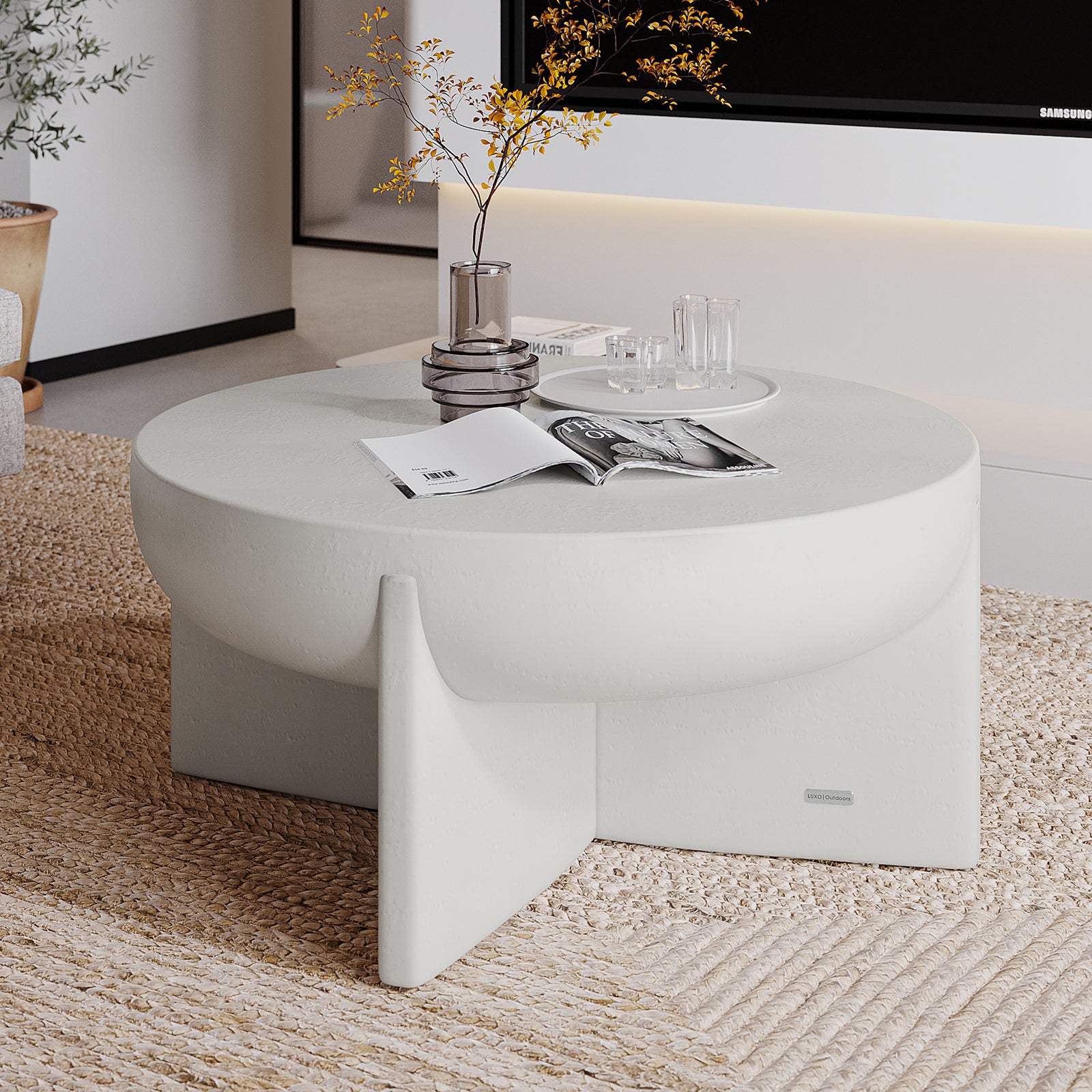 Kora White Concrete Pedestal Coffee Table styled in a modern living room with decor, perfect for indoor outdoor use - Lifestyle