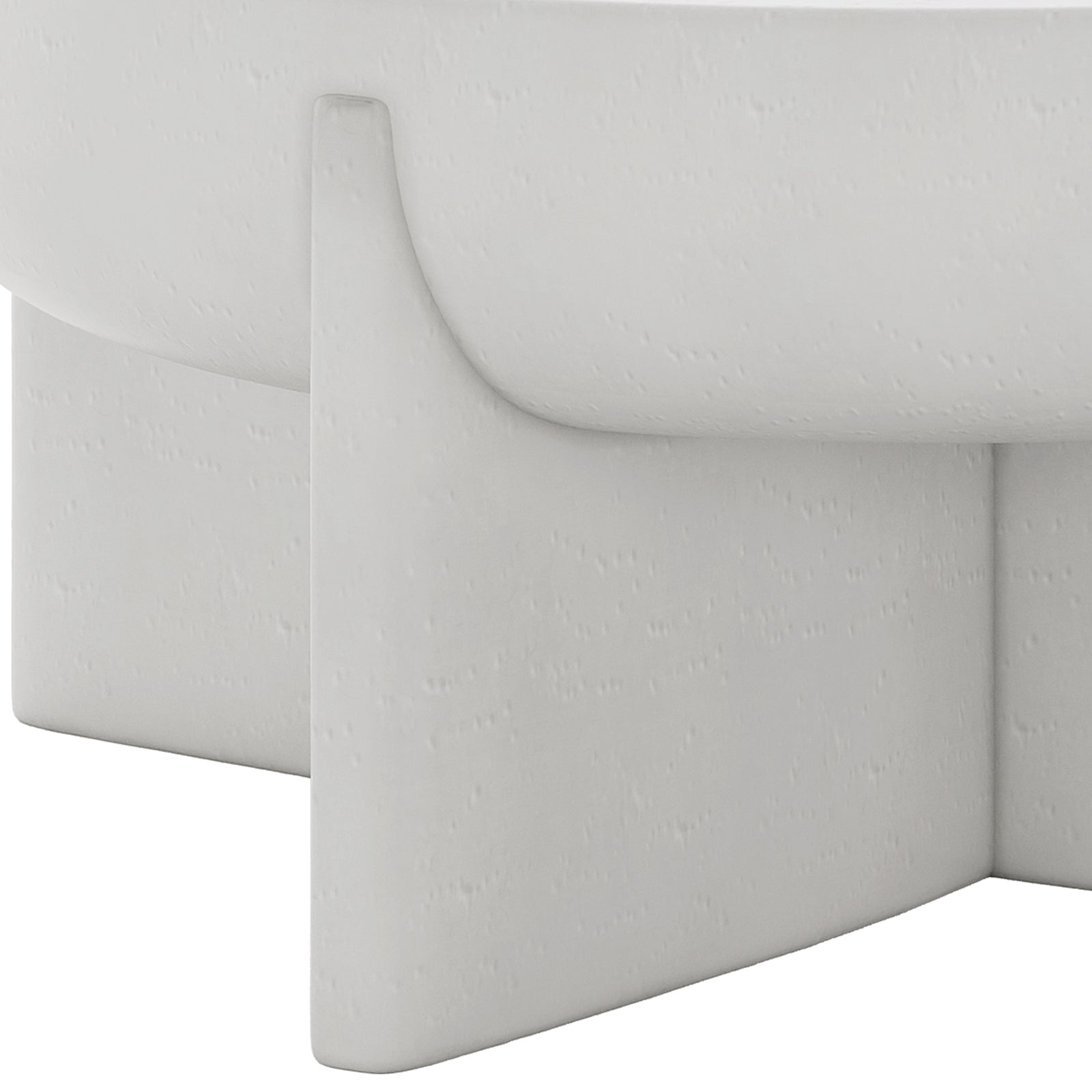 Detail shot of the Kora White concrete coffee table's base and textured finish