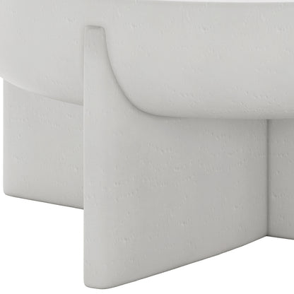 Detail shot of the Kora White concrete coffee table's base and textured finish