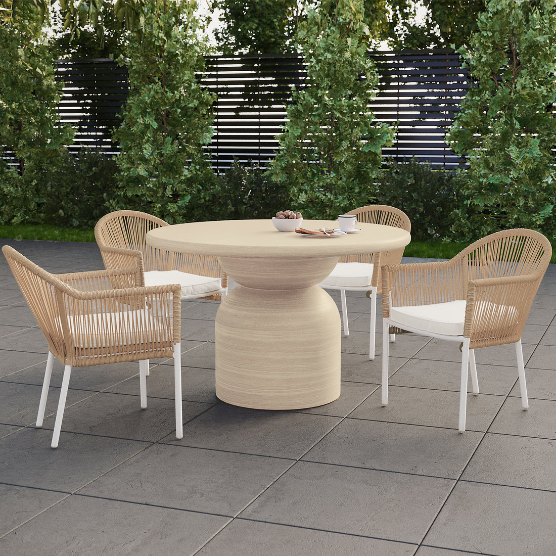 Krates & Mindanao 5pc Outdoor Concrete Dining Set w/ Wicker Chairs Beige on a patio, featuring a round concrete table with four wicker chairs, perfect for alfresco dining.