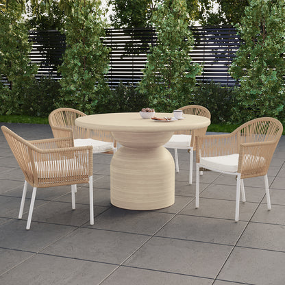 Krates & Mindanao 5pc Outdoor Concrete Dining Set w/ Wicker Chairs Beige on a patio, featuring a round concrete table with four wicker chairs, perfect for alfresco dining.
