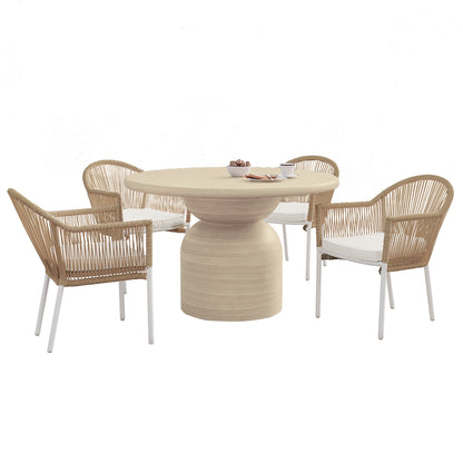 Krates & Mindanao 5pc Outdoor Concrete Dining Set features a round concrete table and wicker chairs, ideal for alfresco dining. The set includes a table with bread and chairs for a cozy meal setup.