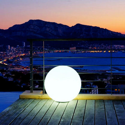 Waterproof Outdoor LED Ball Lights Décor 20cm floating on water; a sleek, round ball creates a magical glow, perfect for outdoor settings like pools or gardens.