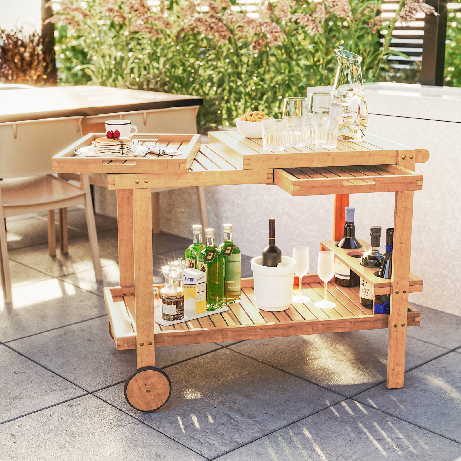 Maiden Solid Wood Outdoor Kitchen Trolley Cart in Natural, featuring a two-shelf design with a removable tray, bottles, stemmed glasses, and snacks, perfect for al fresco dining and entertaining.