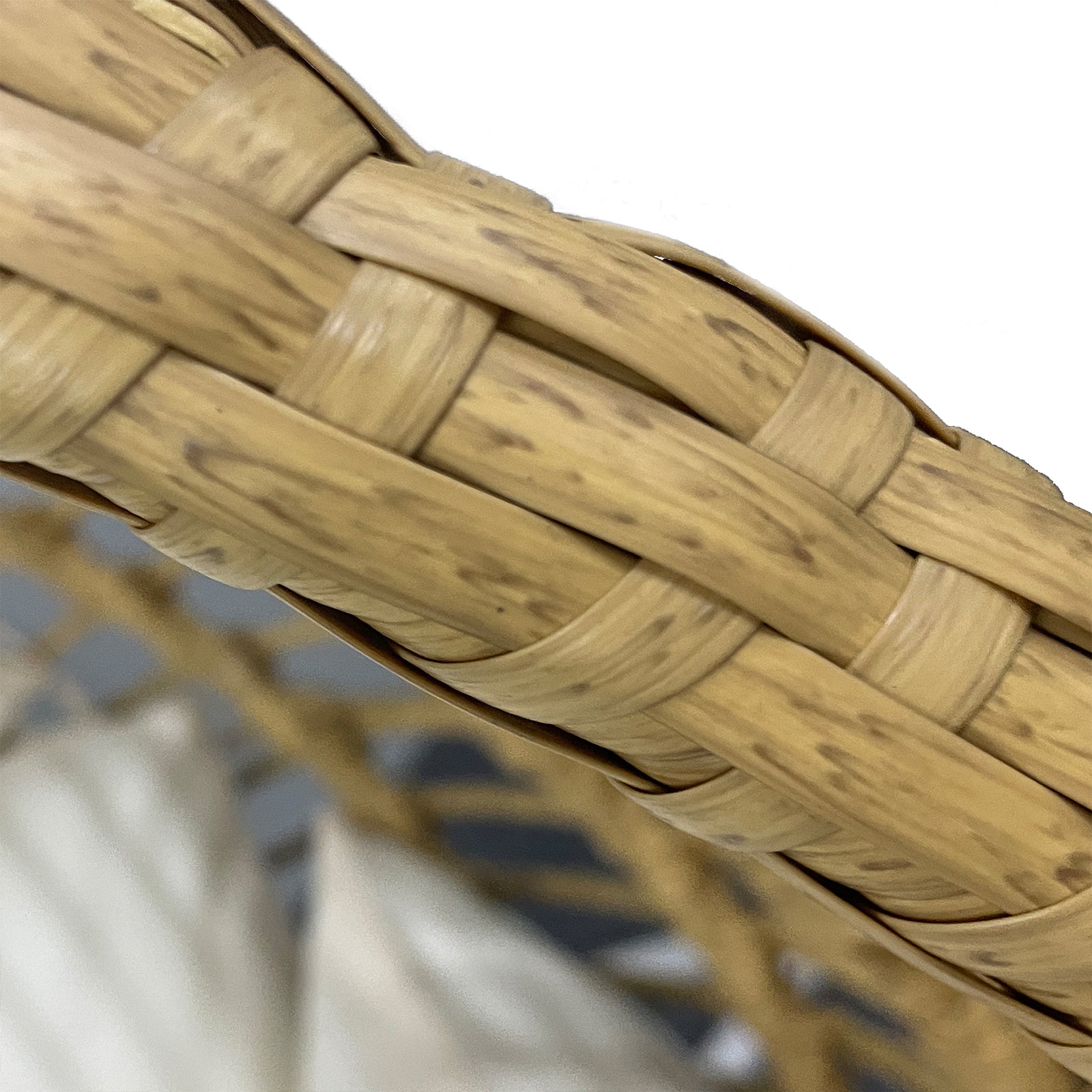 Close-up of Napili Outdoor Rattan Egg Chair w/ Cushion Cream White, featuring a wicker basket design and sturdy wooden elements, showcasing its premium construction and unique shape for outdoor relaxation.