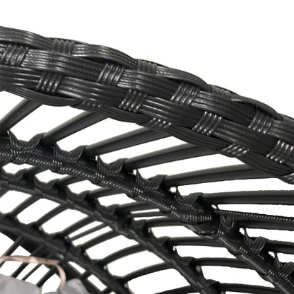 Close-up of Napili Outdoor Rattan Egg Chair with Cushion in Light Grey, showcasing black synthetic wicker strands intricately woven around a tubular metal frame, highlighting its durable and stylish construction.